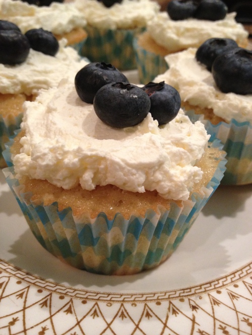 Lemon drizzle cupcake with lemon curd cream and blueberries